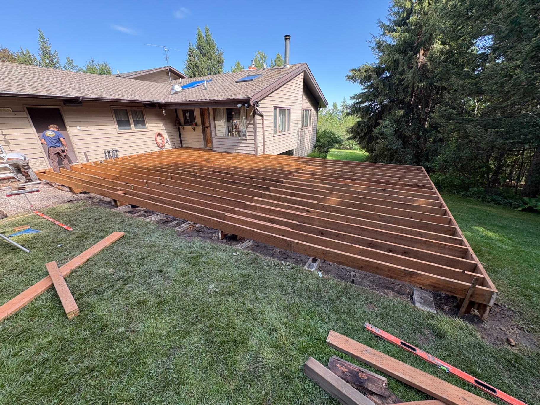 New elevated deck framing over lawn