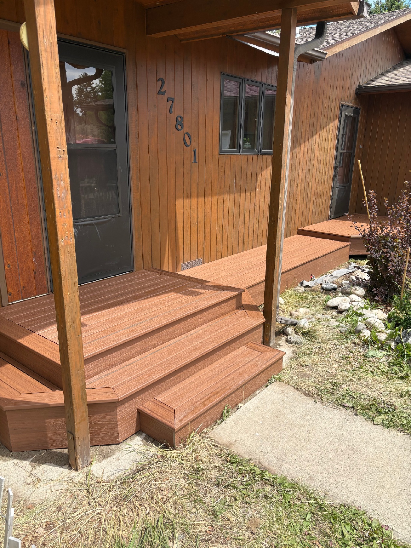 Finished wrap-around composite entry deck with house numbers